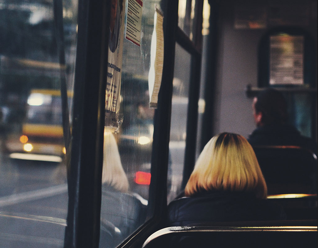 Woman Sitting on Bus